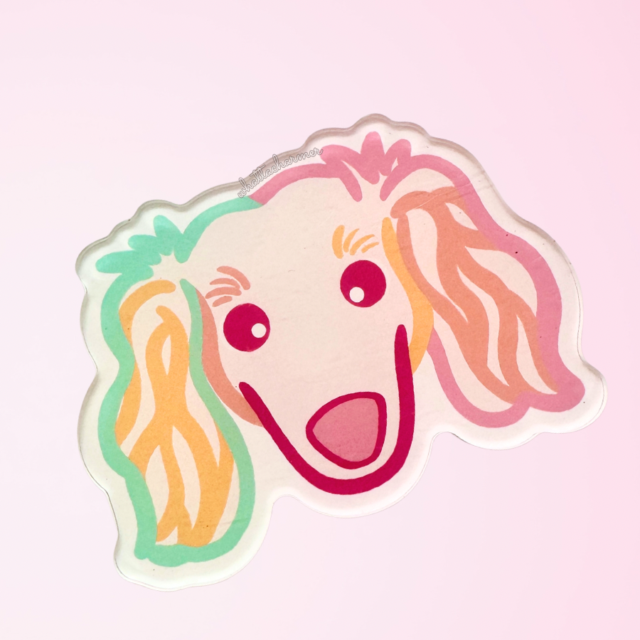 Cartoon longhaired dachshund dog face with colorful outlines on a pink background