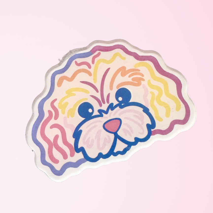 Cartoon cavapoo dog face with colorful outlines on a pink background