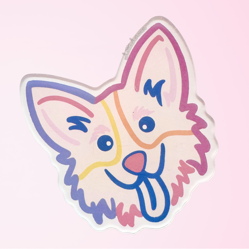 Cartoon corgi dog face with colorful outlines on a pink background