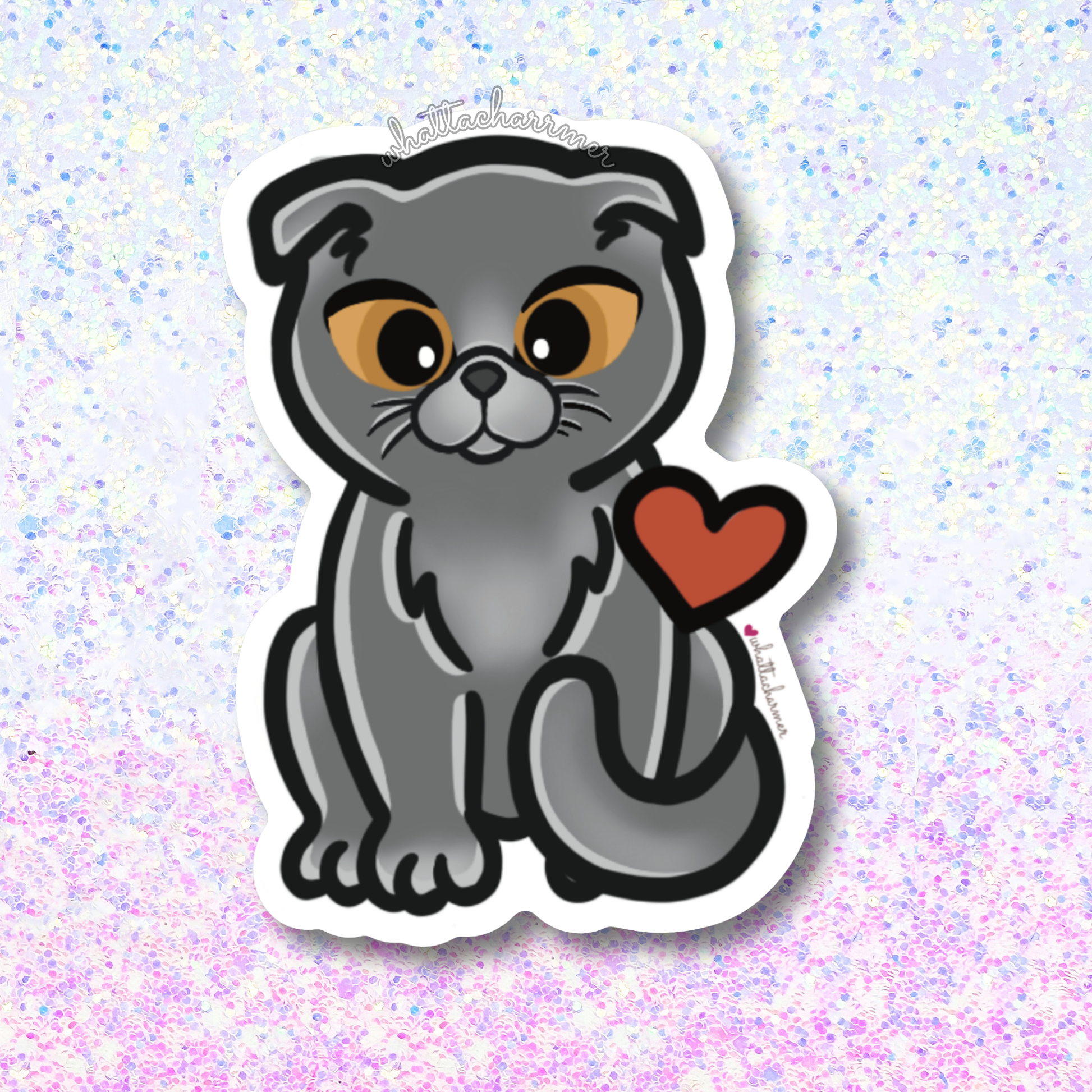 Sticker of a gray Scottish fold cat with a red heart on a glittery background