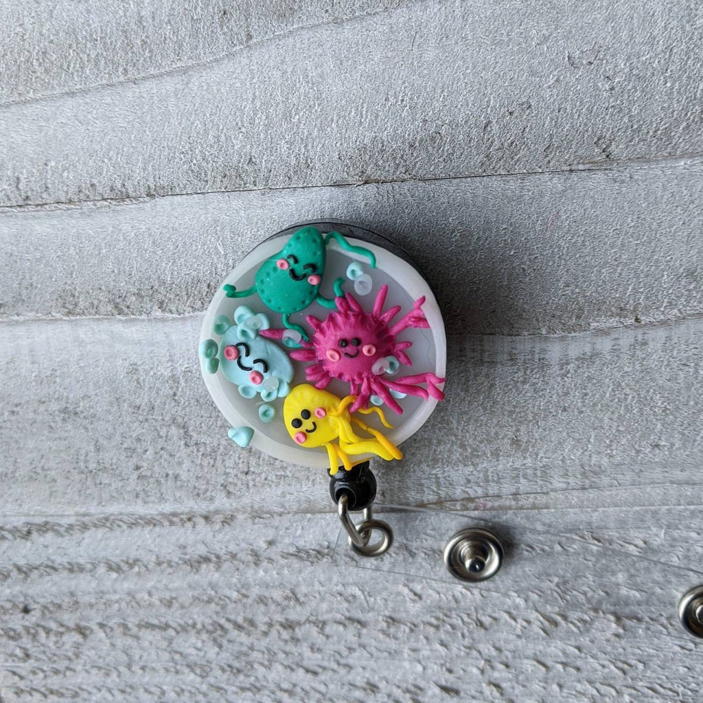 Wiggling Bacteria Petri Dish Badge Reel