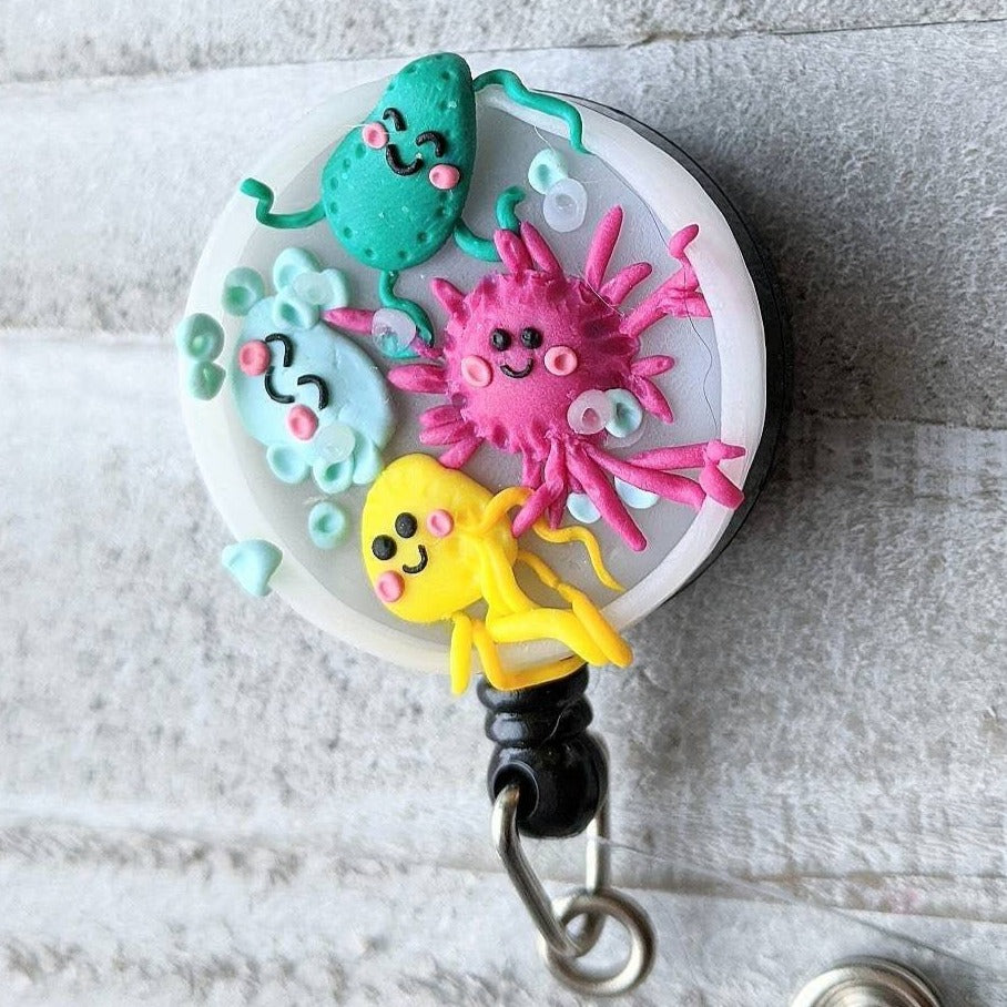 Wiggling Bacteria Petri Dish Badge Reel